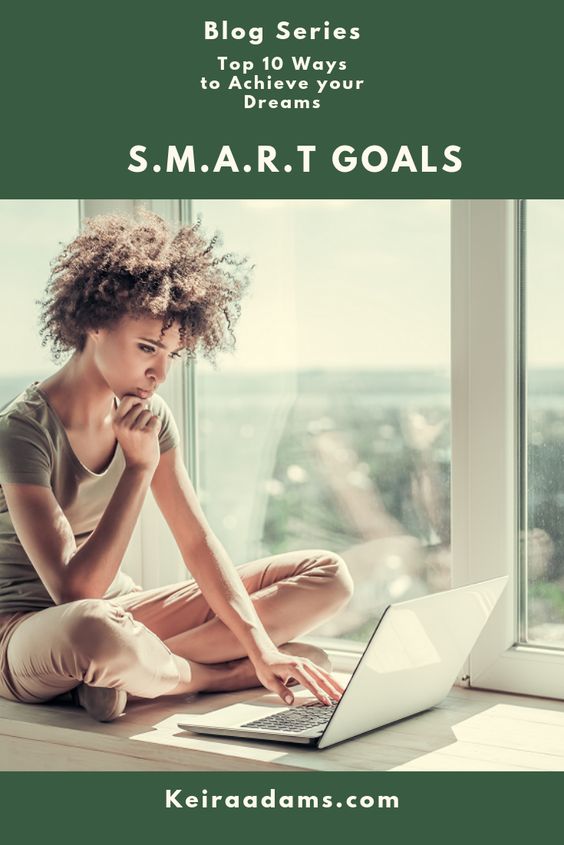 Woman working on laptop in front of a window "Top 10 Ways to Achieve Your Dreams-S.M.A.R.T. Goals"
